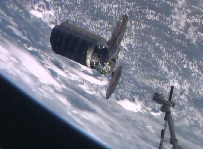 In this frame grab from video shown on NASA TV the Cygnus supply ship approaches the robot arm of the International Space Station in preparation for capture early Wednesday Dec. 9 2015 delivering Christmas presents and much-needed groceries for the