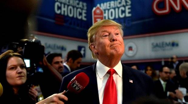 Republican U.S. presidential candidate and businessman Donald Trump speaks to the media in the spin room following the U.S. Republican presidential debate in Las Vegas