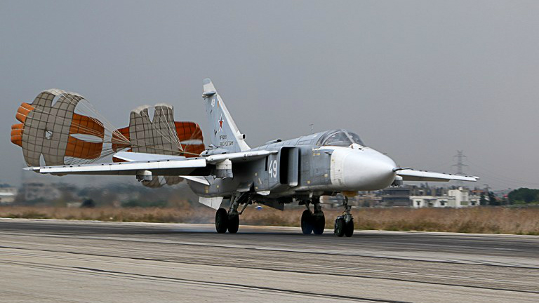 A Russian Sukhoi Su-24 bomber lands at the Russian Hmeimin military base in Latakia province in the northwest of Syria