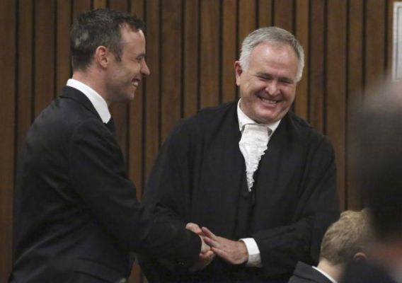 Oscar Pistorius left speaks with his defense lawyer