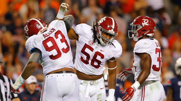 AUBURN AL- NOVEMBER 28 Jonathan Allen #93 Tim Williams #56 and Rashaan Evans #32 of the Alabama Crimson Tide react after a defensive stop against the Auburn Tigers at Jordan Hare Stadium