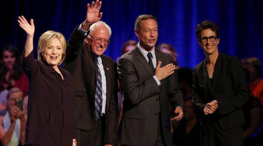 Democratic presidential candidates Hillary Clinton Bernie Sanders Martin O'Malley and television host Rachel Maddow wave to the crowd following the First in the South Presidential Candidates Forum held at Winthrop University