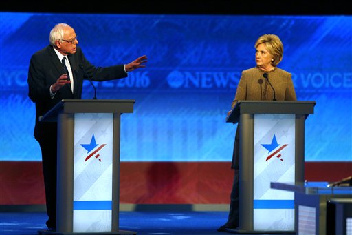 Bernie Sanders left offers an apology to Hillary Clinton during a Democratic presidential primary debate Saturday Dec. 19 2015 at Saint Anselm College in Manchester N.H