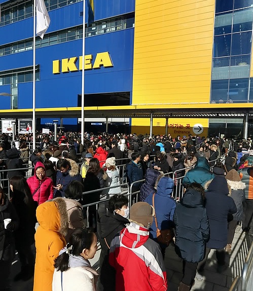 People line up in front of the Swedish furniture brand IKEA store in Gwangmyeong City south of Seoul on Dec. 18 2014. IKEA plans to open four more stores in South Korea in the near future