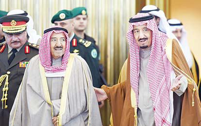 Saudi King Salman bin Abdulaziz, welcomes Amir of Kuwait Sheikh Sabah Al Ahmad Al-Sabah upon the latter’s arrival to attend the 136th Gulf Cooperation Council summit in the Saudi capital Riyadh