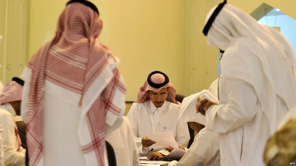 Saudi election officials count votes after a landmark election