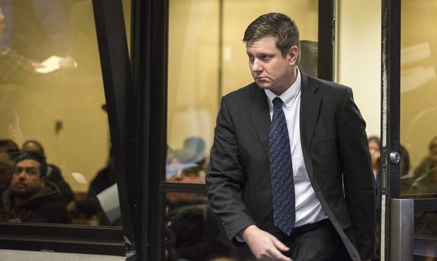 Chicago police Officer Jason Van Dyke arrives for a court hearing at the Leighton Criminal Court Building in Chicago on Friday Dec. 18 2015. It was Van Dyke’s first appearance in court since a grand jury indicted him on Wednesday Dec. 16. He faces