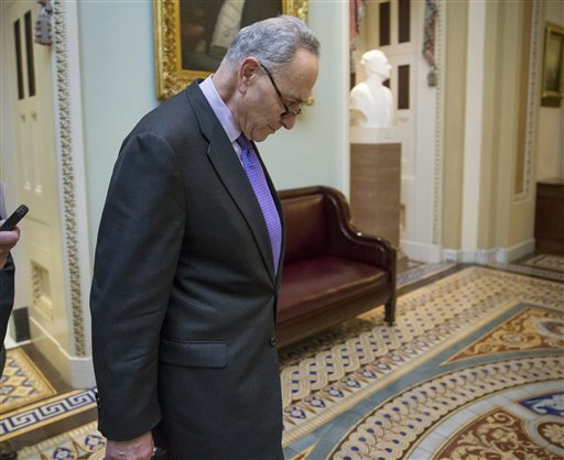 Sen. Chuck Schumer D-N.Y. returns to the chamber as a group of Senate Democrats led by Schumer offer a series of gun control amendments to the budget bill on Capitol Hill in Washington Thursday Dec. 3 2015. The GOP-controlled Senate voted 50-47 agai