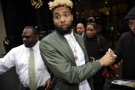 New York Giants&#146 Odell Beckham Jr. leaves NFL headquarters in New York Wednesday Dec. 23 2015. Hearing officer James Thrash upheld the suspension for multiple violations of safety-related playing rules after hearing an appeal by the New York Giant