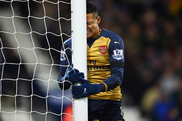 Alexis Sanchez reacts after missing a chance