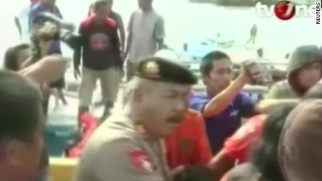 Dozens missing after Indonesian ferry hit rough seas