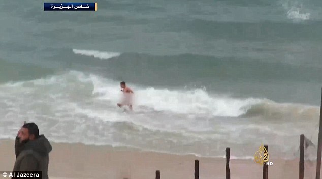 Shocking footage showed the man swimming naked in the Mediterranean Sea when the unseen soldiers opened fire on him