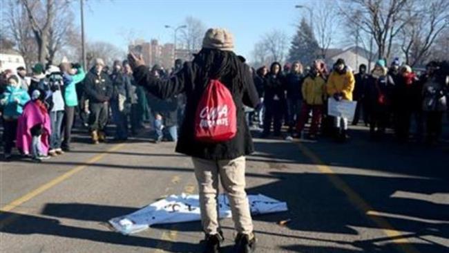 The protesters maintain their vigil over the death of a black man who was shot by police last week