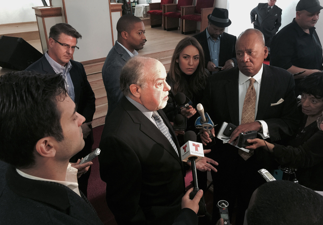 Michael D. Robbins center attorney for the family Laquan McDonald speaks at a news conference Friday Dec. 11 2015 in Chicago. The family of McDonald