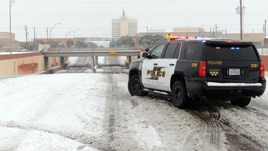 Odessa Police block access to the railroad underpass on Grant Avenue near Second Street Sunday Dec. 27 2015 in Odessa Texas. Nearly all of Interstate 40 in Texas the main east-west highway through the Texas Panhandle has been shut because of the