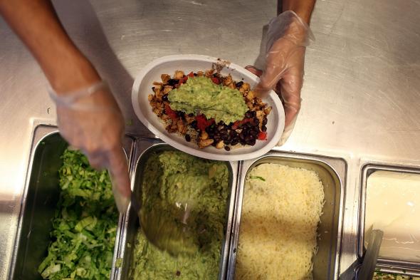 471371482-chipotle-restaurant-workers-fill-orders-for-customers