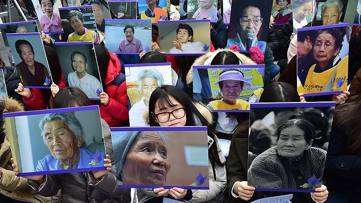 South Korean supporters hold portraits of former'comfort women, who were forced into wartime sexual slavery for Japanese soldiers