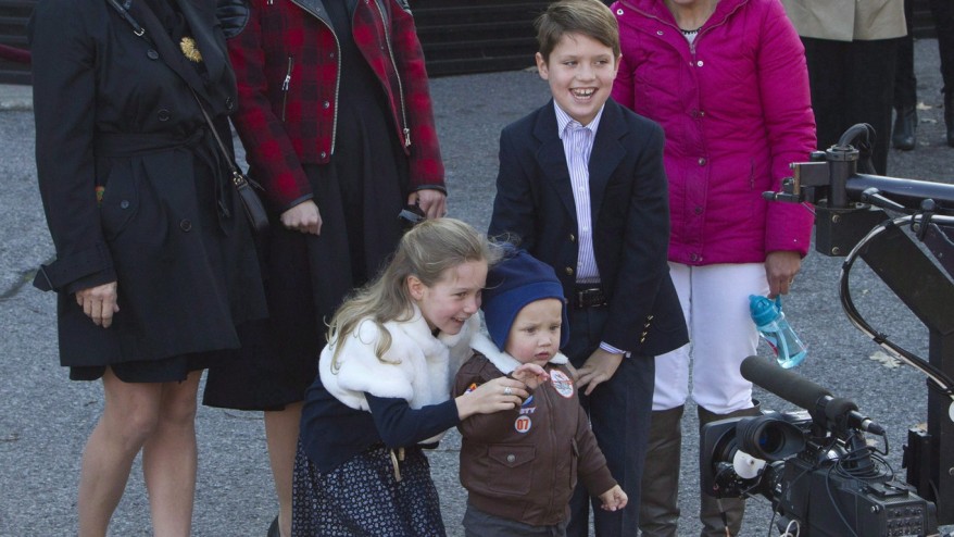 A woman holds Hadrien Trudeau 1 at his father's swearing-in ceremony on Nov. 4 at Rideau Hall. The woman is one of two people hired to work with the Trudeau family according to appointments announced by the government