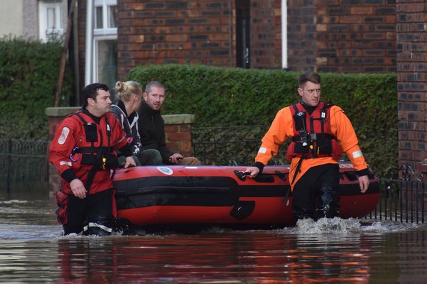 Stenning Fire officers rescuing residents of flooded Victoria Road area of Carlisle