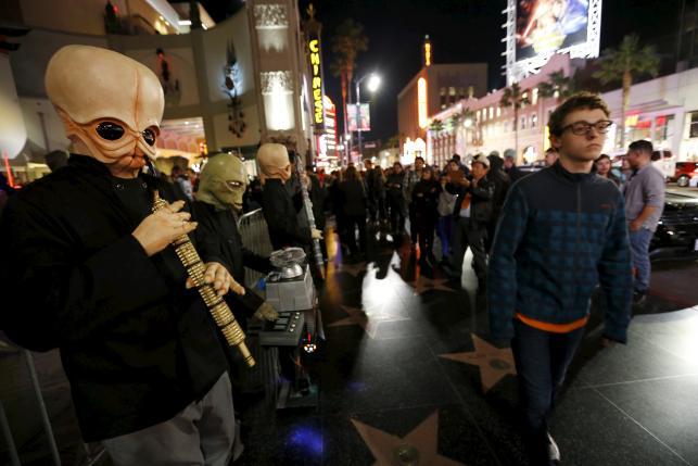 People dressed as the fictional band Figrin D'an and the Modal Nodes stand before the first showing of the movie'Star Wars The Force Awakens at the TCL Chinese Theatre in Hollywood California