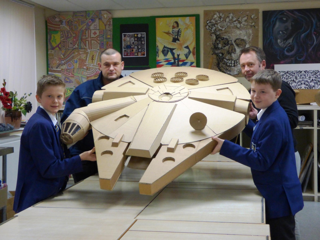 Fulneck art teacher John Hargreaves back left with Aaron Murphy and pupils Jake Ellis front left and Ethan Newman with their recycled replica of the Star Wars Millennium Falcon spaceship