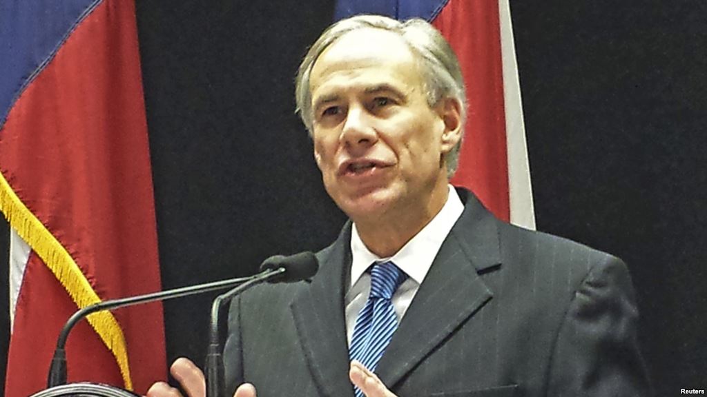 FILE- Texas Governor Greg Abbott is among more than two dozen governors mostly Republicans who have vowed to keep Syrian refugees from resettling in their states