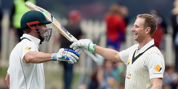 Australia's Adam Voges right celebrates with team mate Shaun Marsh after getting his double century against the West Indies during their cricket test match in Hobart