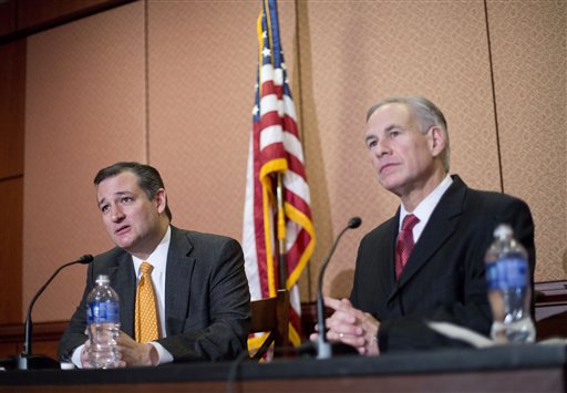 Republican presidential candidate Sen. Ted Cruz R-Texas left and Texas Gov. Greg Abbott right speak about the resettlement of Syrian refugees in the U.S. during their joint news conference on Capitol Hill in Washington Tuesday Dec. 8 2015. Abbott