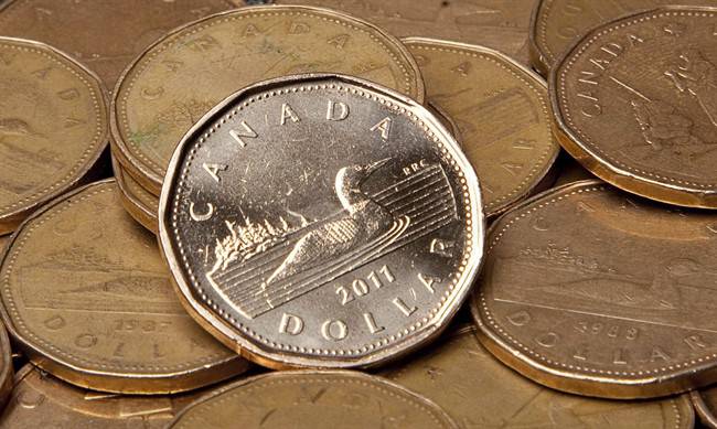 Stock markets positive, loonie turns down