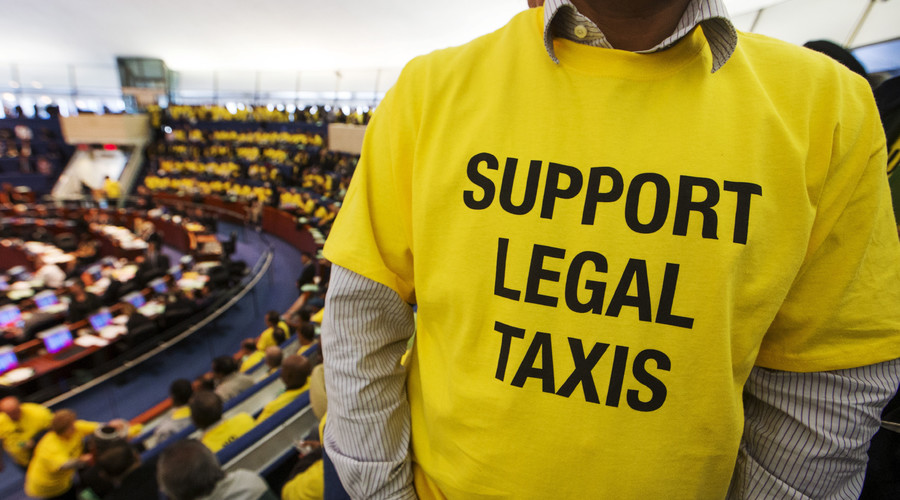 Taxi driver Sajjad Ahmad attends the city council to protest Uber in Toronto