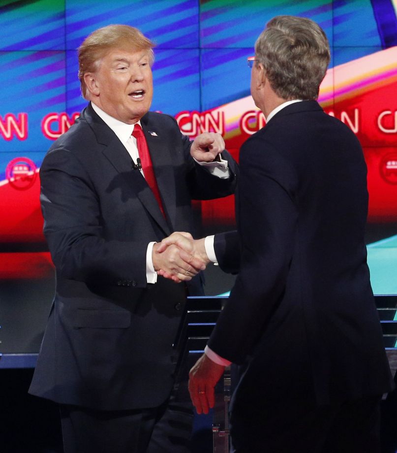 Donald Trump left and Jeb Bush talk together following the CNN Republican presidential debate at the Venetian Hotel & Casino on Tuesday Dec. 15 2015 in Las Vegas