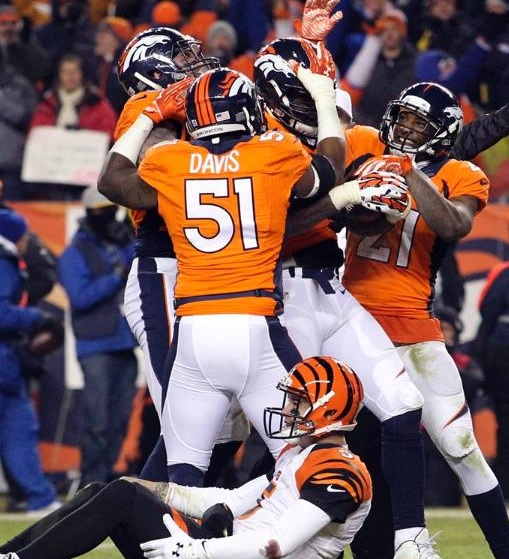 The Broncos celebrate their victory after recovering an A.J. Mc Carron fumble