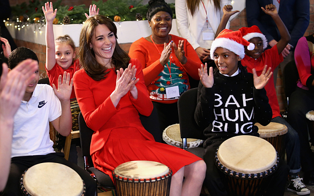 The Duchess of Cambridge plays a bongo drum at the Anna Freud Centre in London