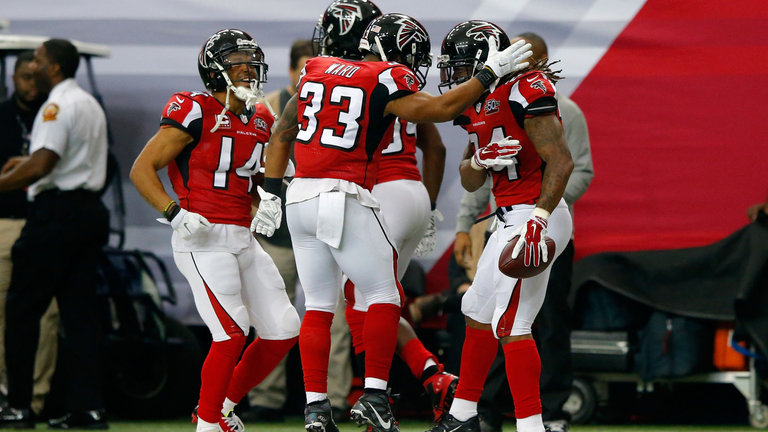 The Falcons celebrate a touchdown during their upset of the Panthers