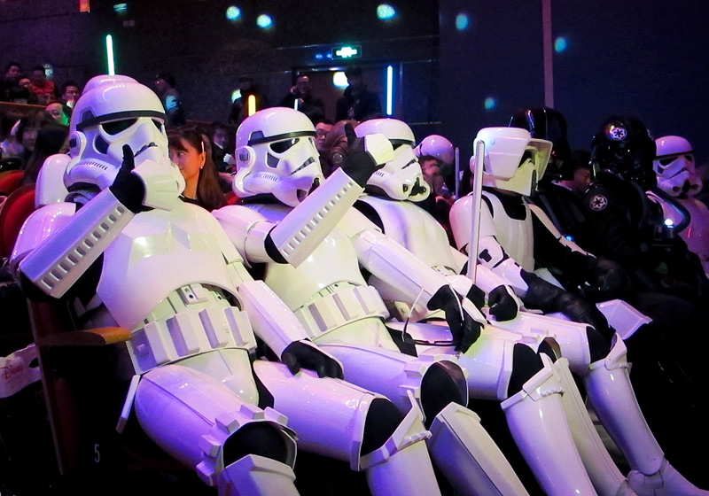 Chinese fans dressed as Star Wars character Stormtroopers gesture as they arrive for the premiere