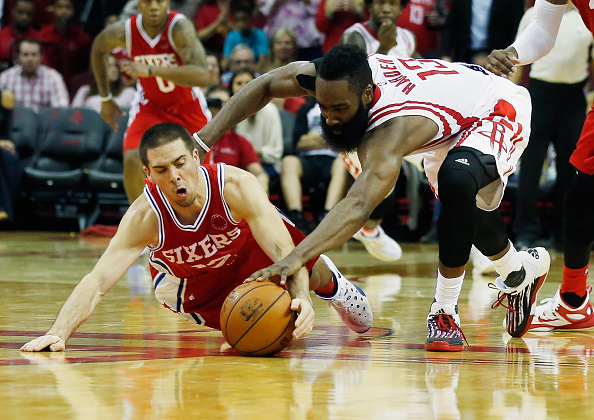 James Harden #13 of the Houston Rockets battles for the basketball with T.J. Mc Connell #12 of the Philadelphia 76ers during their game at the Toyota Center