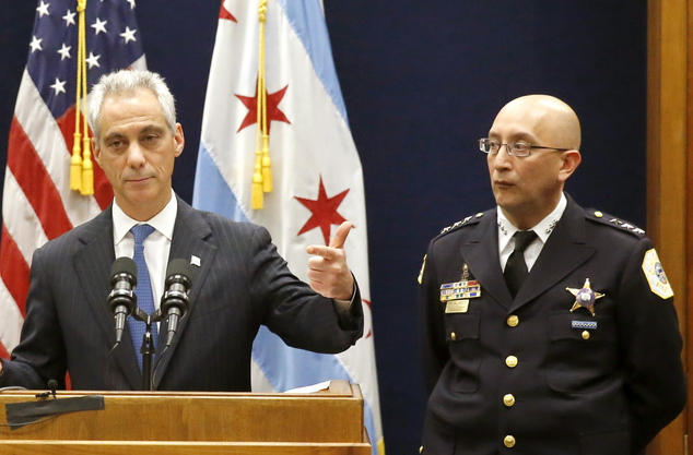 Chicago Mayor Rahm Emanuel accompanied by Interim Chicago Police Superintendent John Escalante speaks during a news