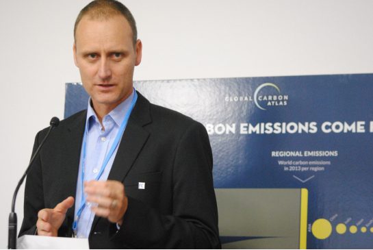 Researcher Glen Peters of the Center for International Climate and Environmental Research briefs reporters in Paris on Monday