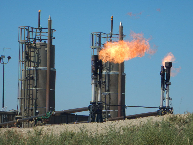 A new Stanford-led study finds that global fossil-fuel emissions like the carbon dioxide emitted from this natural gas flare at a North Dakota oil well could show a decline this year