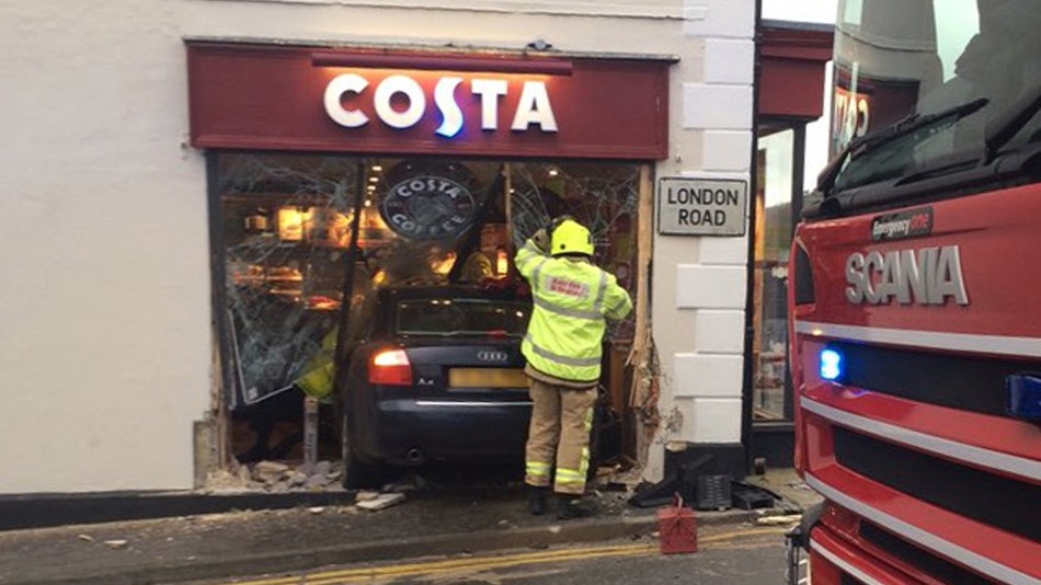 The car smashed into the front window of the coffee shop