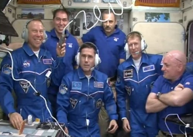 The crew aboard the International Space Station including Major Tim Peake second from the right