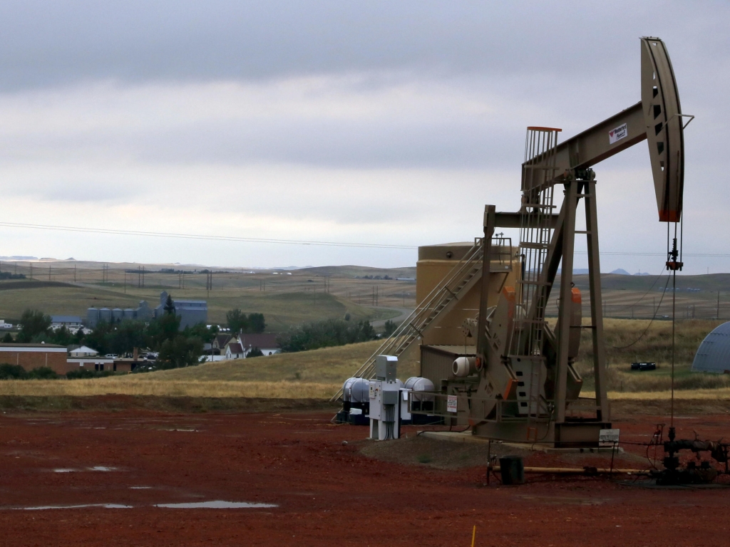 The lifting of the ban could be a boon for domestic oil producers. Above an oil pump near Alexander N.D in September