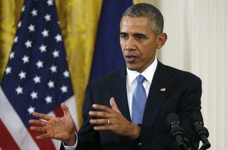 U.S. President Barack Obama addresses a joint news conference with French President Francois Hollande in the East Room of the White House in Washingt