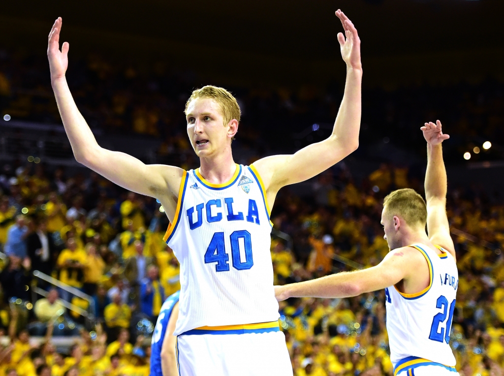 LOS ANGELES CA- DECEMBER 03 Thomas Welsh #40 of the UCLA Bruins and Bryce Alford #20 celebrate a lead over the Kentucky Wildcats after a timeout during the first half at Pauley Pavilion