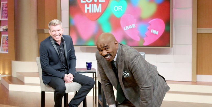 Todd Chrisley and Steve Harvey on the set of Harvey's show. Chrisley was not tolerating any smack talk about his friend