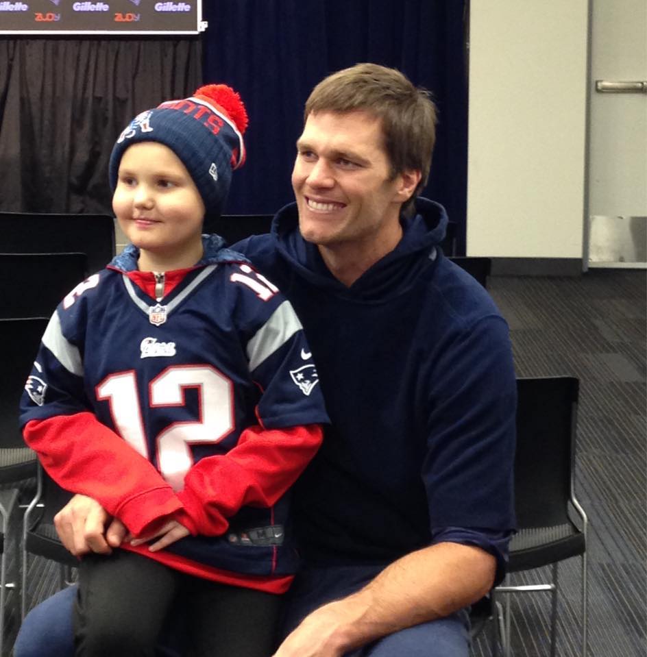 New England Patriots quarterback Tom Brady with super fan Hailey Steward of Bethel who has leukemia. Brady invited Hailey to visit him at the team's Foxborough Mass headquarters after reading her story in the Portland Press Herald