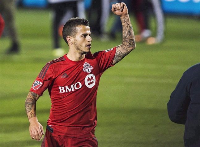 Toronto FC's Sebastian Giovinco celebrates a win against the New York Red Bulls during MLS action in Toronto