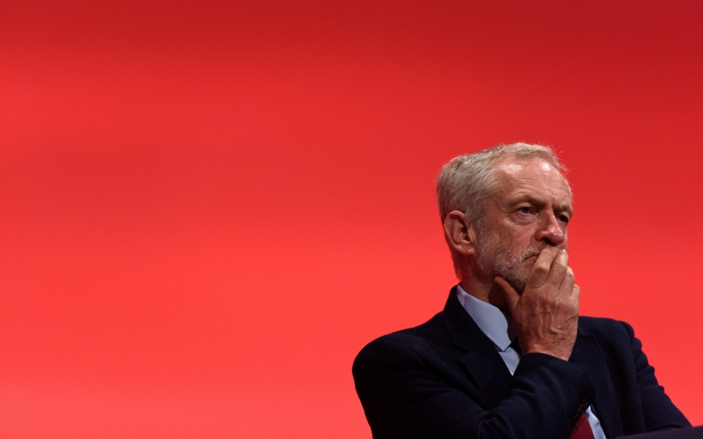 Jeremy Corbyn listens to Tom Watson speak at the Labour conference earlier this year