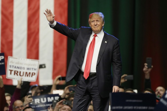 Republican presidential candidate businessman Donald Trump acknowledges the crowd before addressing supporters at a campaign rally in Grand Rapids Mich. Months of intense focus on the Republican race and front-runner Trump