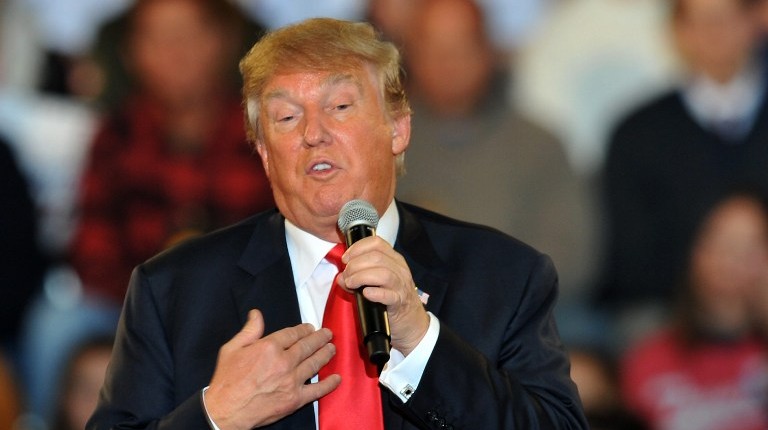 Republican presidential candidate Donald Trump speaks at a town hall style campaign rally at the Varied Industries Building at Iowa State Fair Grounds